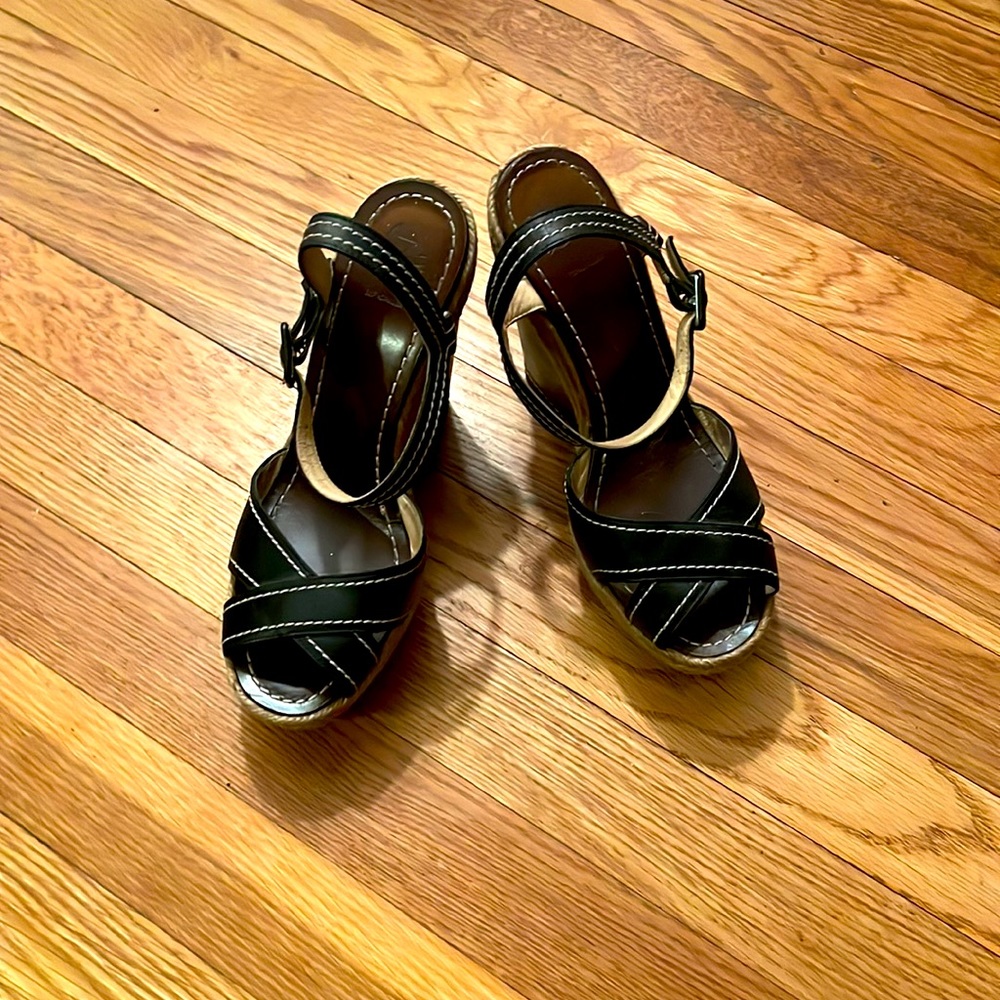 Size 7 Christian Louboutin black espadrille with red bottom sole protectors.